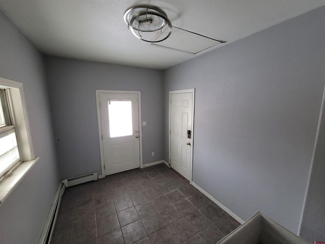 doorway to outside with baseboard heating and plenty of natural light