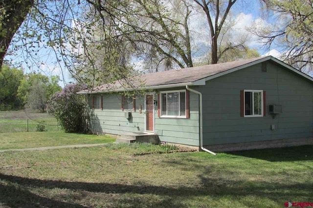 ranch-style house with a front lawn