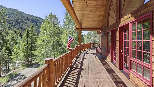 wooden deck featuring a mountain view