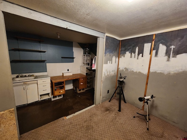 bathroom with sink and a textured ceiling