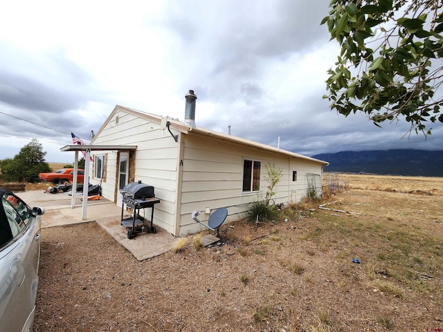 view of side of property featuring a mountain view