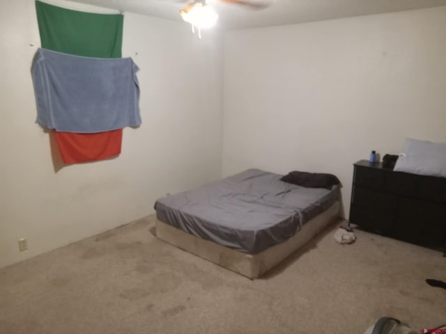 carpeted bedroom with ceiling fan and billiards