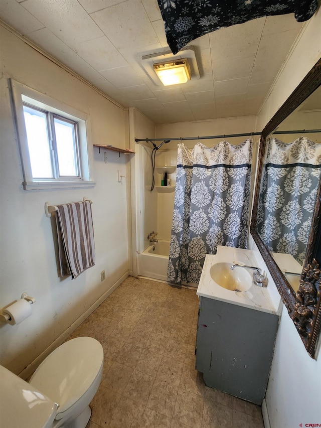 full bathroom featuring toilet, vanity, and shower / bath combo