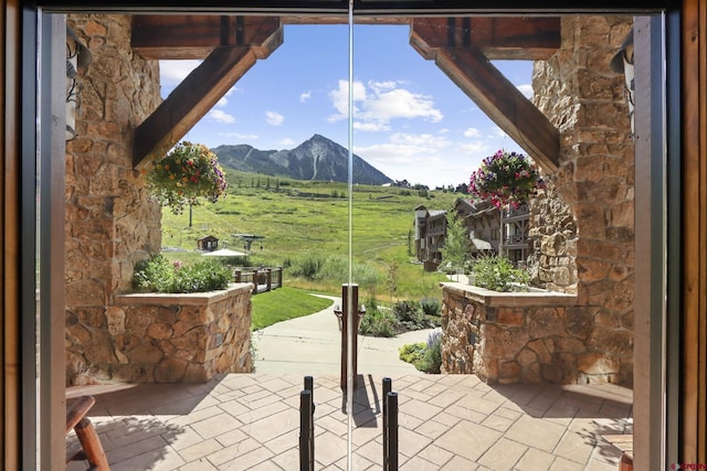 view of patio featuring a rural view and a mountain view