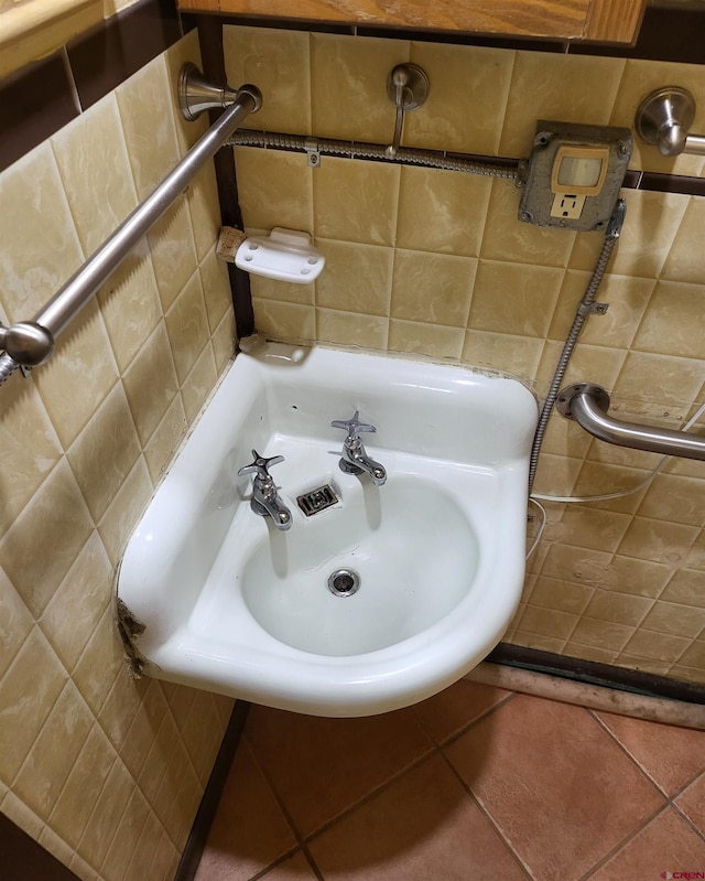 bathroom with sink and tile patterned flooring