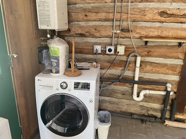 clothes washing area featuring washer / clothes dryer