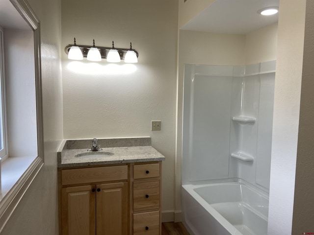 bathroom with shower / tub combination and vanity