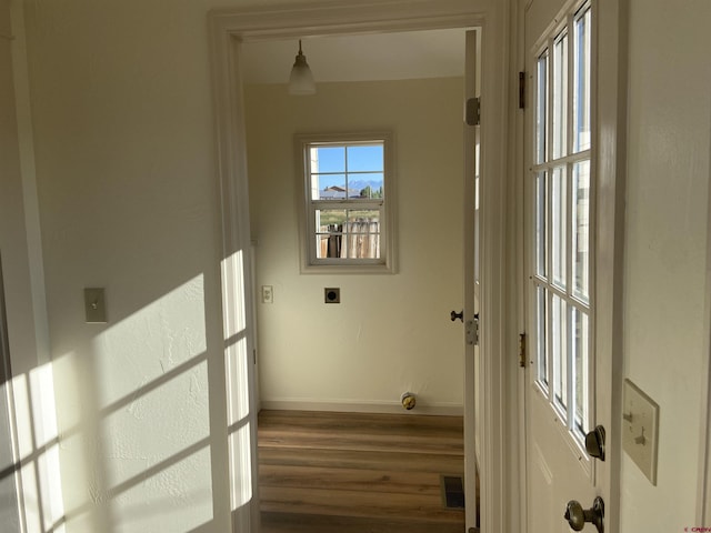 hallway with dark hardwood / wood-style floors