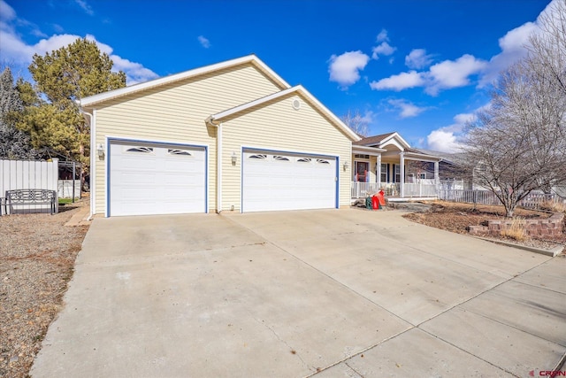 ranch-style home with a porch and a garage