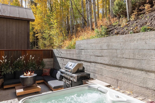 view of swimming pool with a hot tub and grilling area