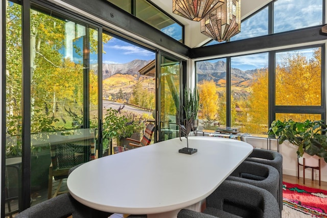 sunroom / solarium featuring a mountain view