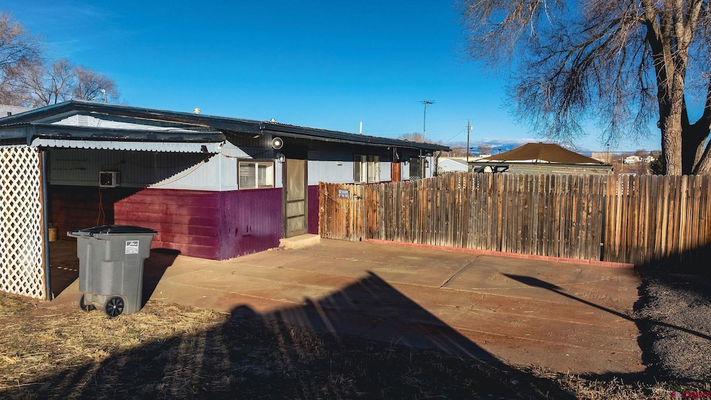 view of side of home with a patio