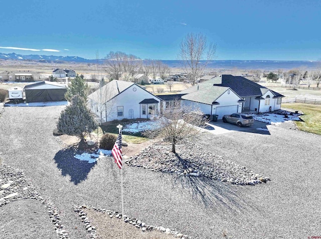 drone / aerial view featuring a mountain view