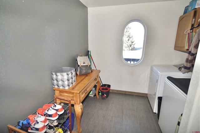 washroom featuring washer and dryer and cabinets