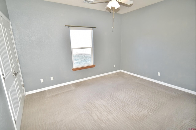 spare room with carpet flooring and ceiling fan