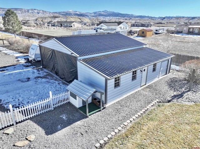 birds eye view of property with a mountain view