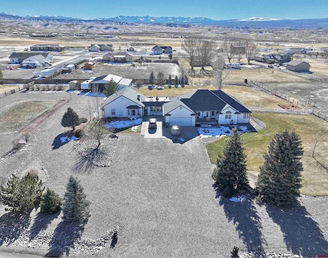 birds eye view of property with a mountain view