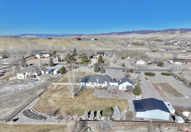 birds eye view of property featuring a mountain view