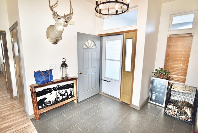 foyer featuring an inviting chandelier and a healthy amount of sunlight