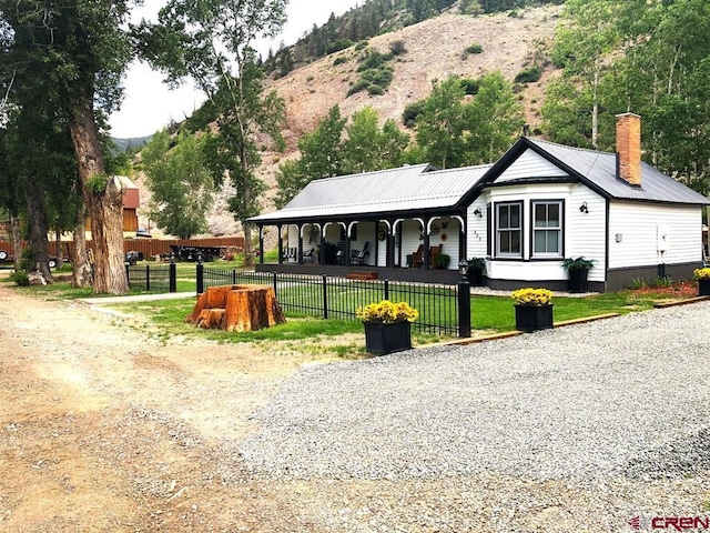 exterior space featuring a porch and a mountain view