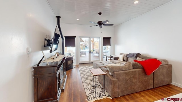 living room with hardwood / wood-style floors and ceiling fan