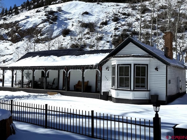 exterior space featuring a covered pool and covered porch