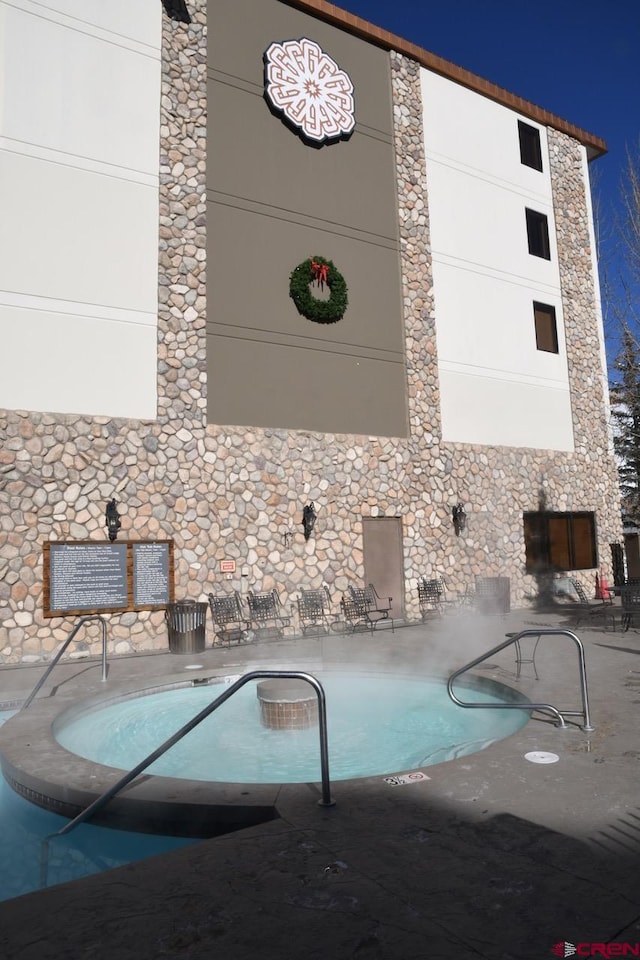 view of swimming pool with a patio