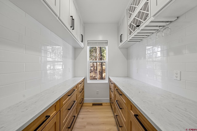 spacious closet with light wood-type flooring