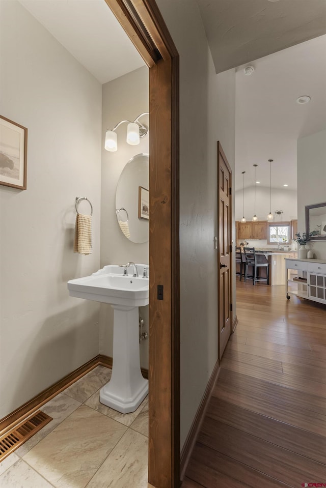 bathroom featuring hardwood / wood-style flooring