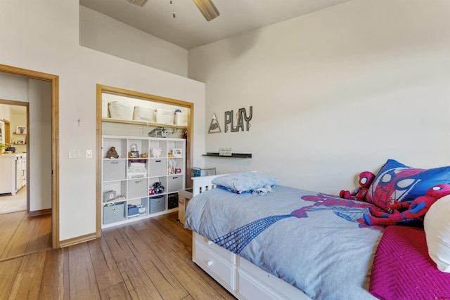 bedroom with ceiling fan and light hardwood / wood-style floors