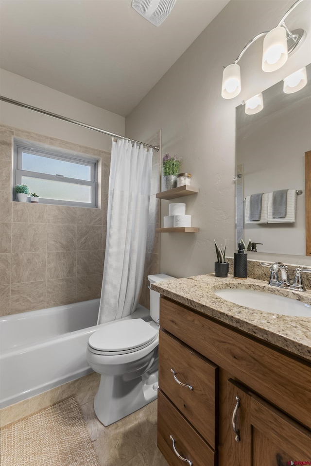 full bathroom featuring toilet, vanity, tile patterned flooring, and shower / tub combo