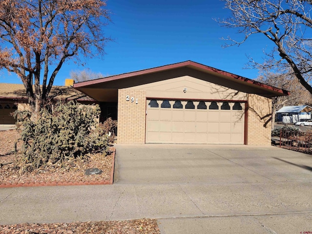 ranch-style home featuring a garage