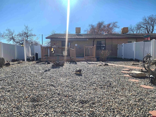 rear view of house with a deck