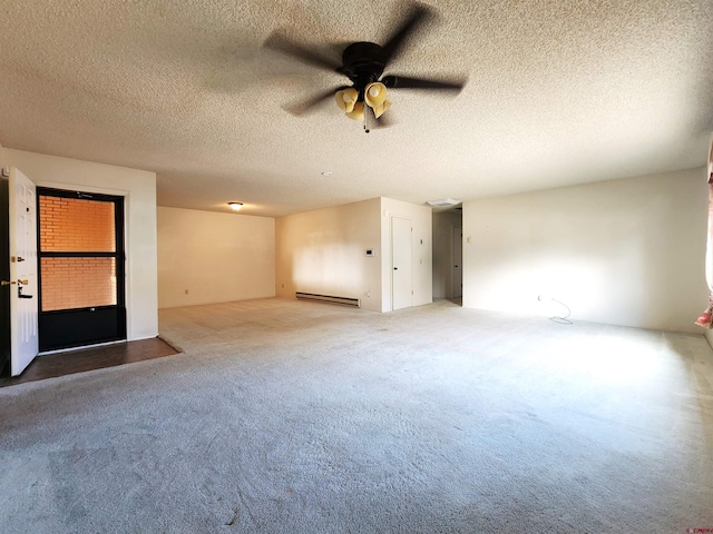 empty room with ceiling fan, carpet flooring, a textured ceiling, and a baseboard radiator