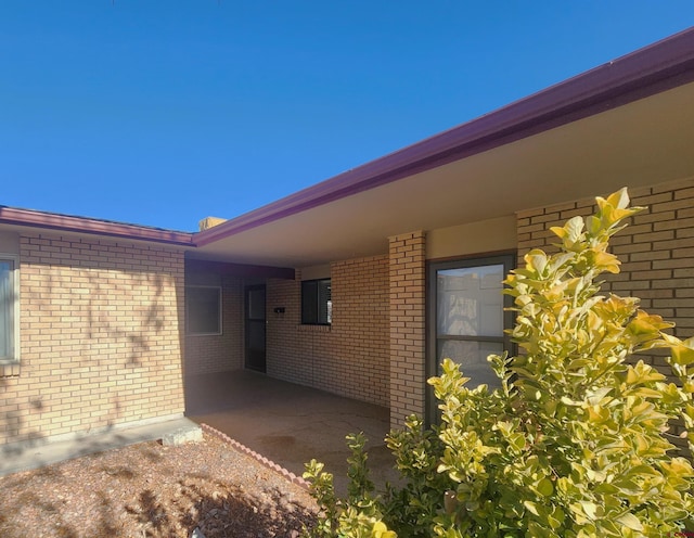 view of side of home featuring a carport