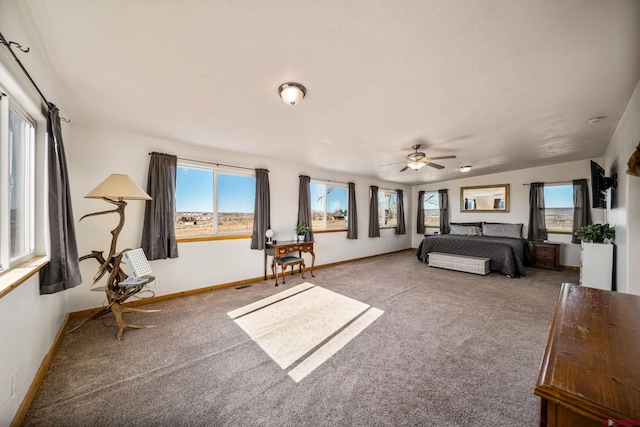 unfurnished bedroom with ceiling fan and carpet