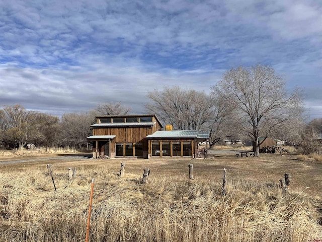 rear view of property featuring a rural view