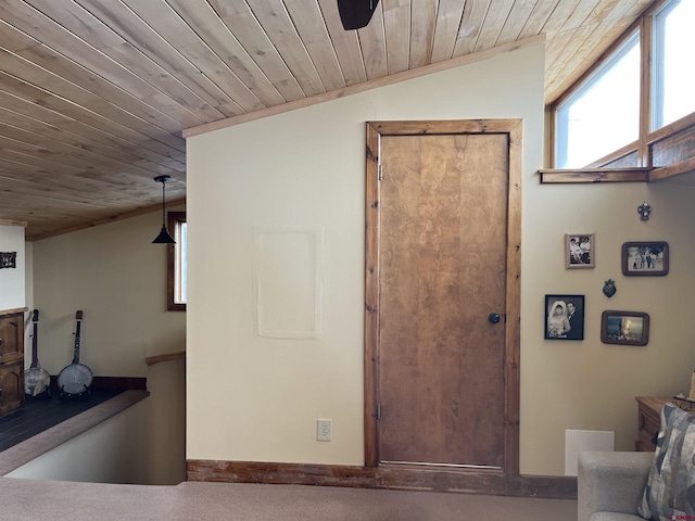 interior space with wooden ceiling, lofted ceiling, and ceiling fan