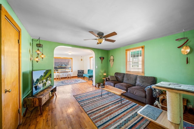 living room with ceiling fan and wood-type flooring