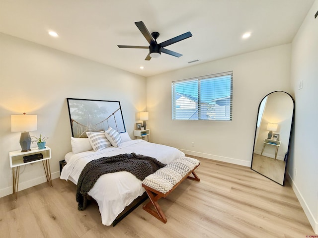 bedroom with ceiling fan and light wood-type flooring