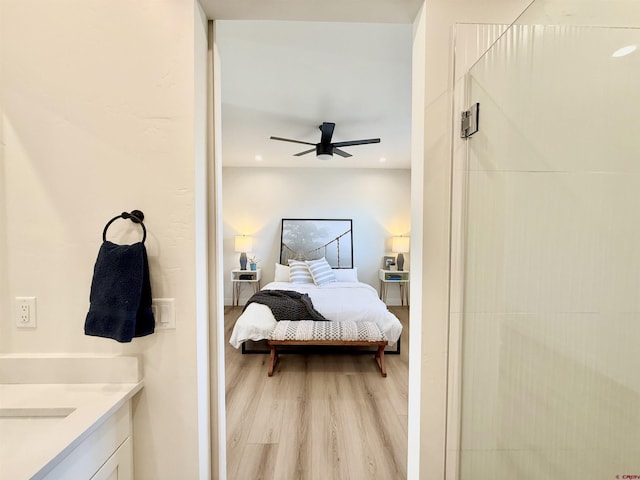 bedroom featuring ceiling fan and light wood-type flooring