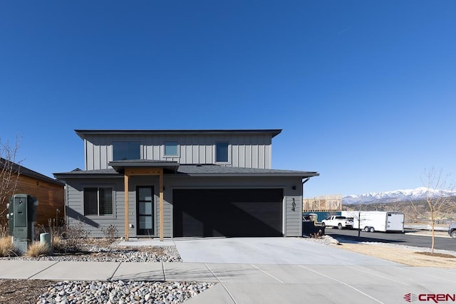 view of front of house featuring a mountain view and a garage