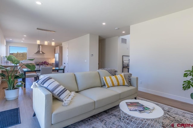 living room with light hardwood / wood-style floors