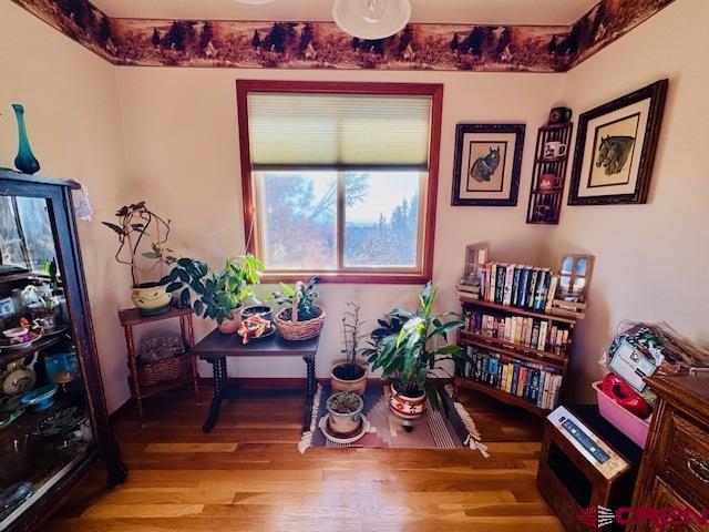 sitting room with light hardwood / wood-style flooring