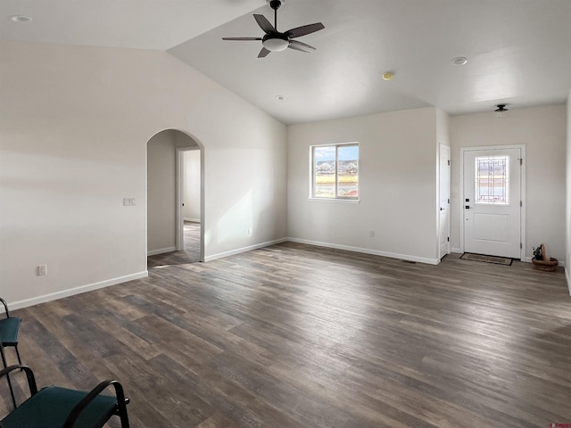 unfurnished living room featuring ceiling fan, dark wood-type flooring, and lofted ceiling