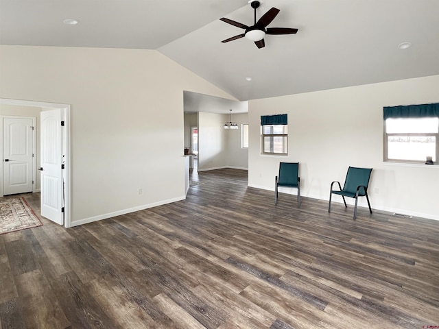 unfurnished living room featuring ceiling fan, lofted ceiling, and dark hardwood / wood-style floors