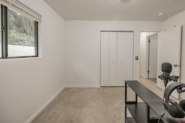 office area featuring light colored carpet