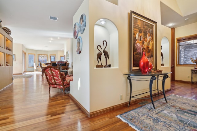 corridor featuring hardwood / wood-style floors