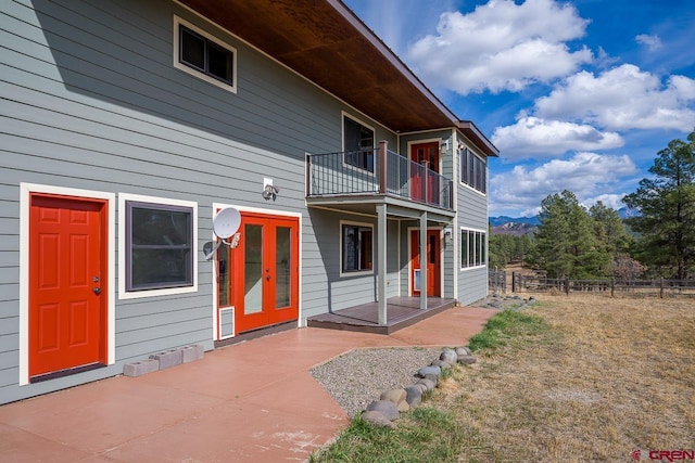 exterior space with a balcony and a patio area