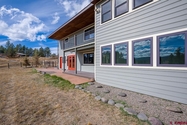 view of side of property featuring a patio